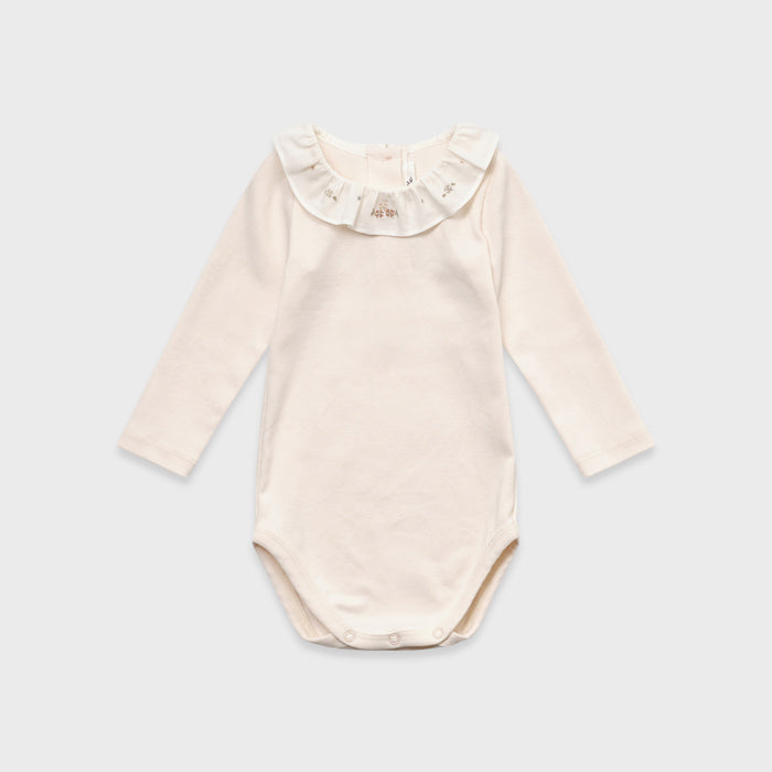 Grenouillère bébé fille en coton rose pâle à volants