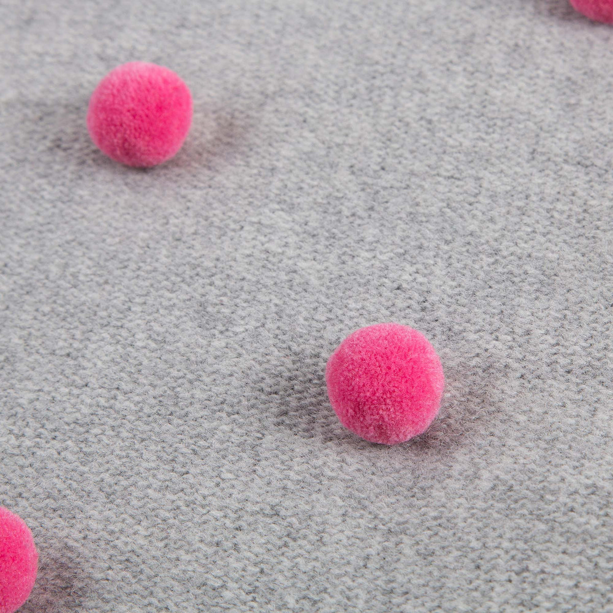 Robe tricotée en laine grise pour bébé fille avec pompons