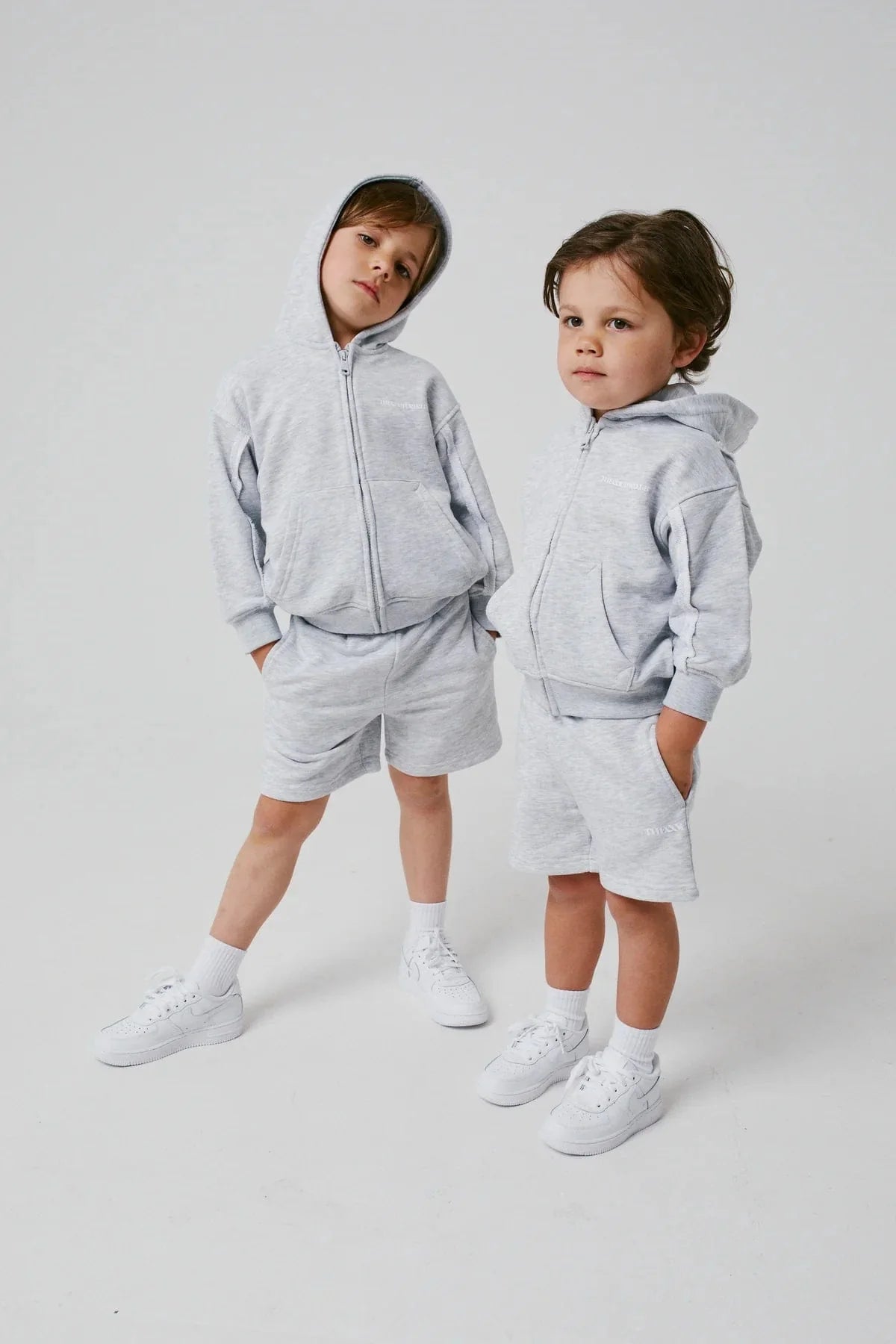 The Couture Club Kids Raw Seam Shorts in Grey