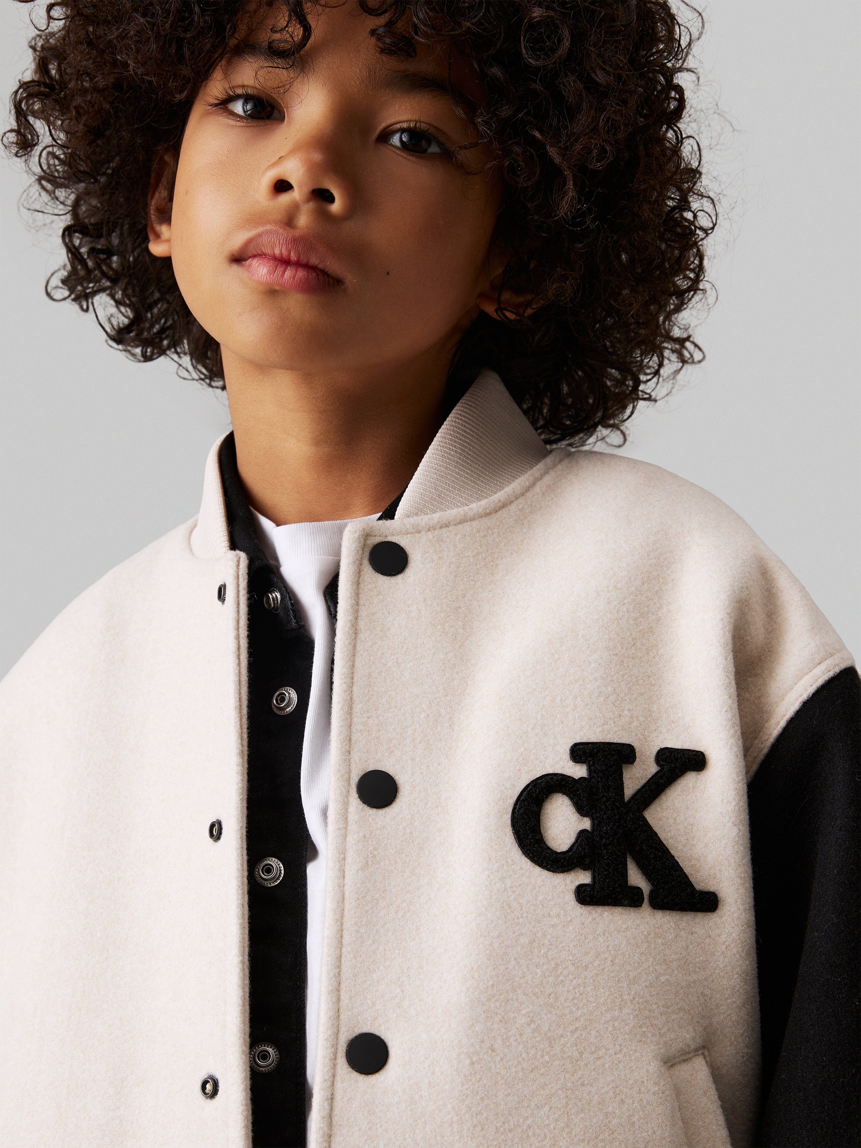 Calvin Klein Boys Heather Varsity Jacket in Beige