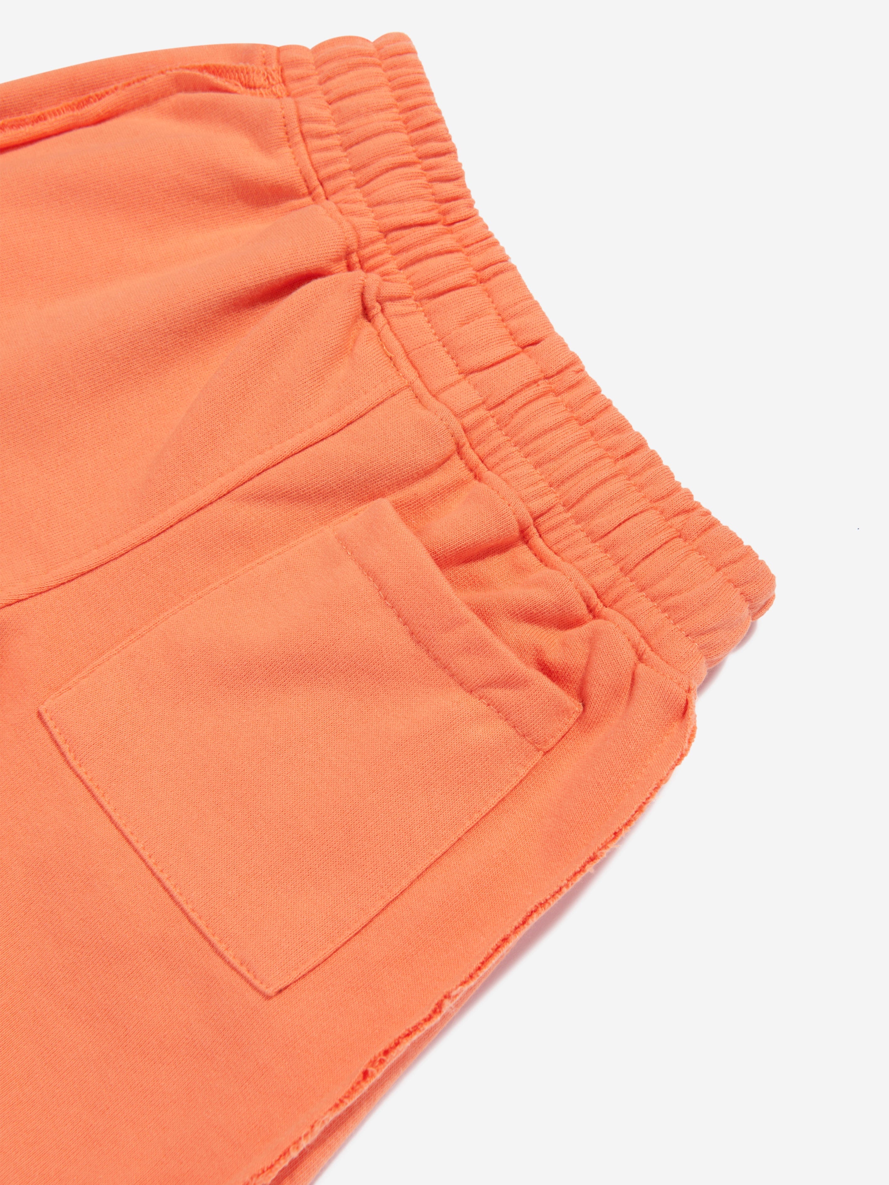 The Couture Club Kids Raw Seam Shorts in Orange