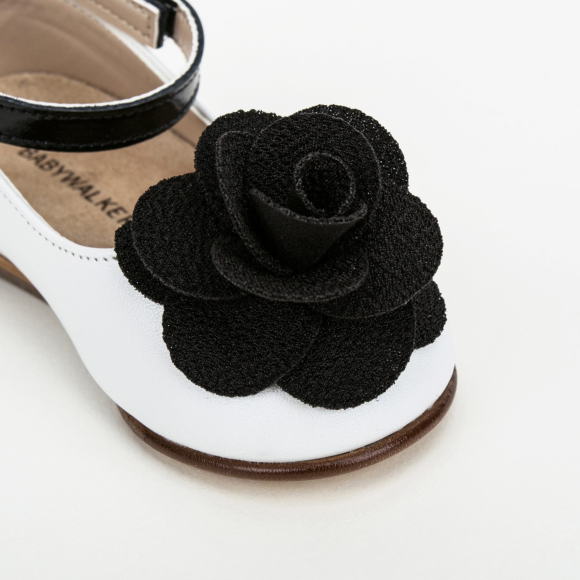 Girls White Suede Ballerinas With Black Patch Camelia Flower Embellished