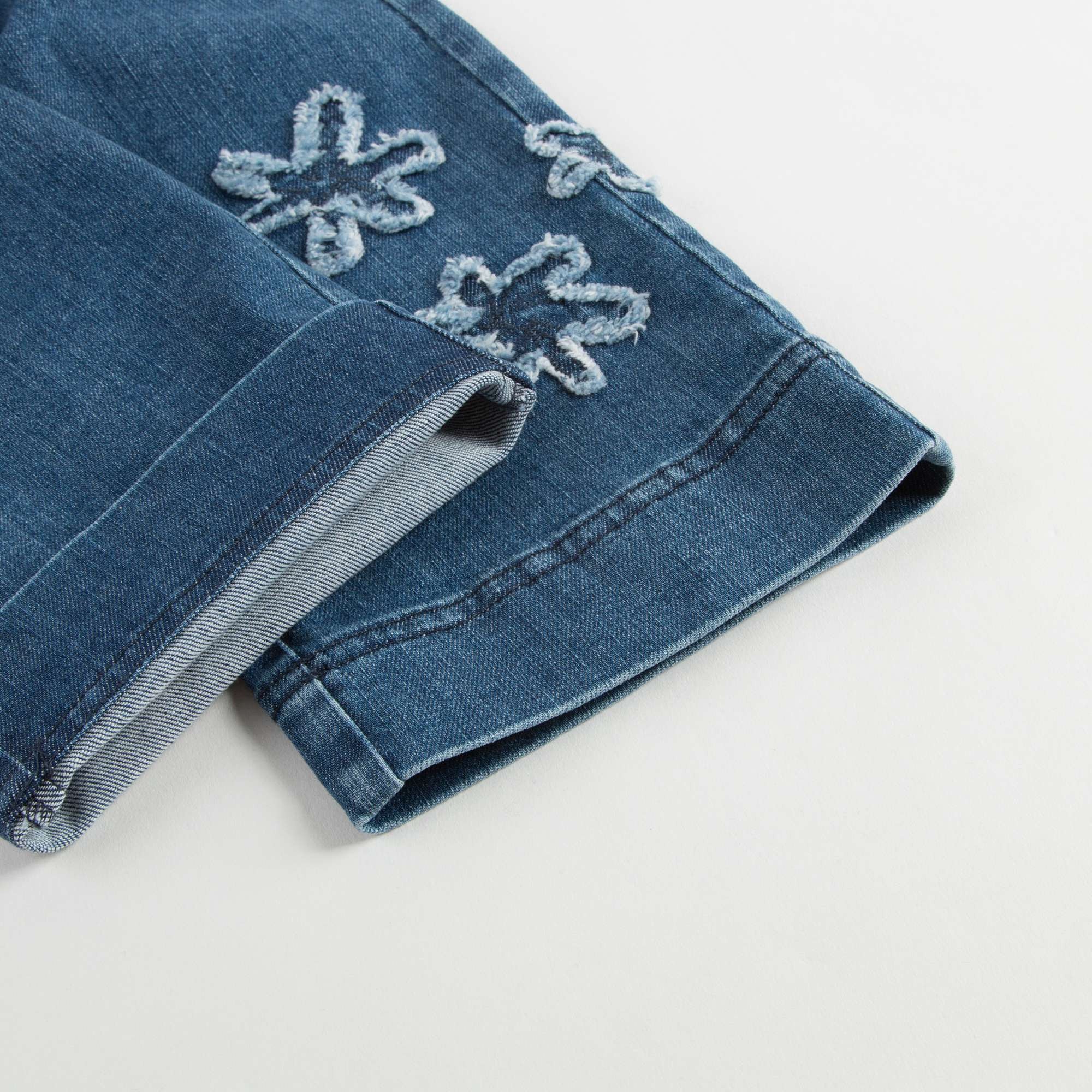 Girls Denim Blue Cotton Jeans With Flowers Trims